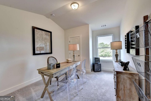 office space with vaulted ceiling and carpet floors