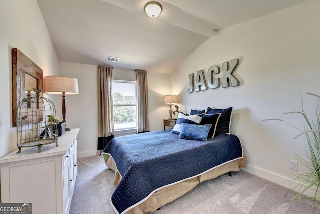 bedroom with lofted ceiling and light carpet