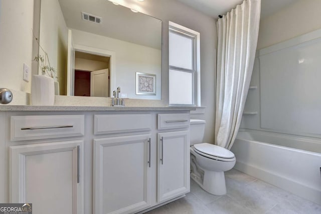 full bathroom featuring vanity, tile patterned flooring, shower / bath combination with curtain, and toilet