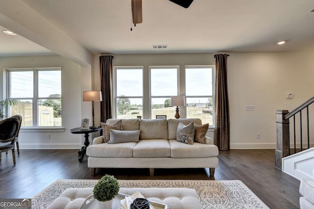 living room with ceiling fan and dark hardwood / wood-style floors