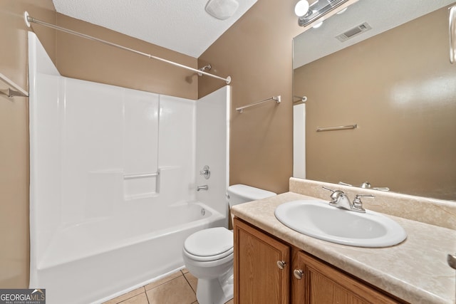 full bathroom with tile patterned flooring, vanity, toilet, tub / shower combination, and a textured ceiling