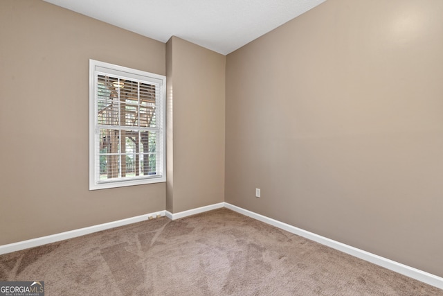 view of carpeted spare room