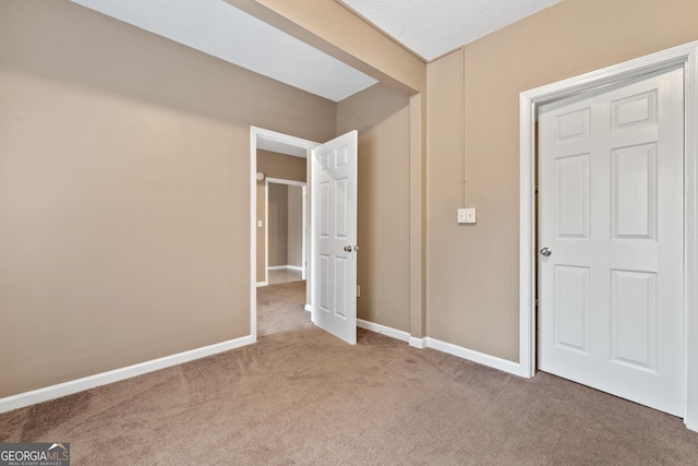 unfurnished bedroom featuring carpet floors