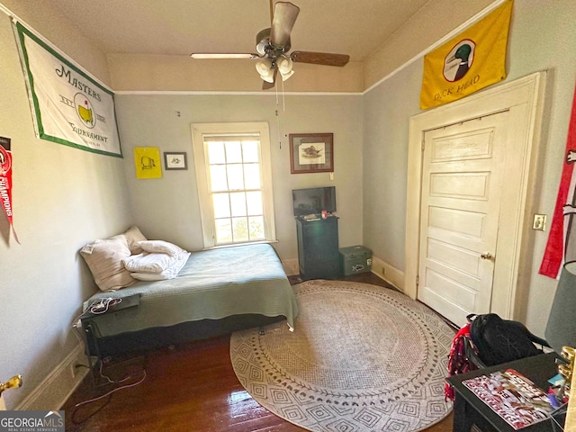 bedroom featuring hardwood / wood-style flooring and ceiling fan