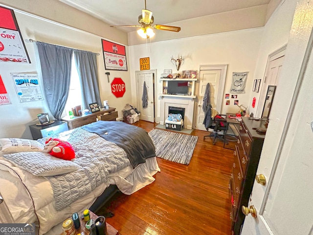 bedroom featuring ceiling fan and wood-type flooring