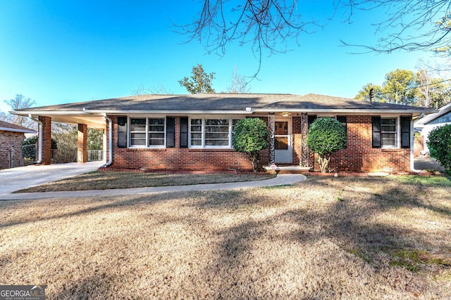 ranch-style house with a carport and a front yard