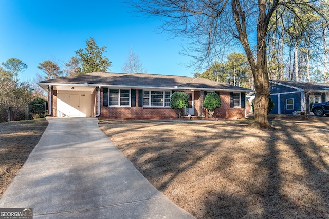 single story home featuring a front lawn and a carport