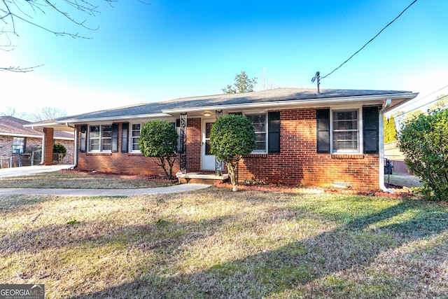 ranch-style home with a front lawn