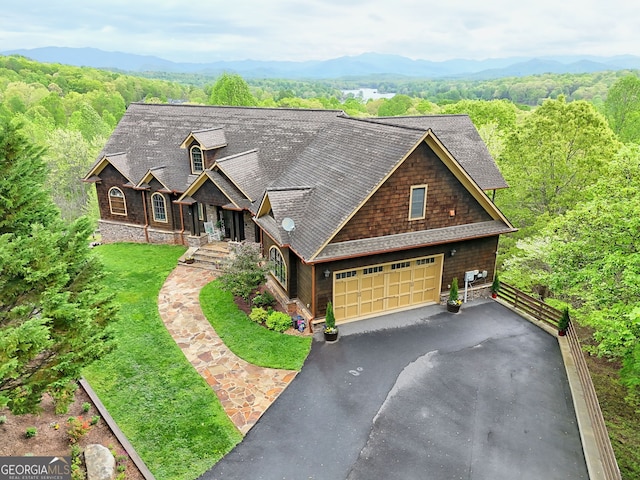 4431 Furman Gribble Rd, Young Harris, GA 30582 - view of front of home with driveway, a wooded view, roof with shingles, and fence
