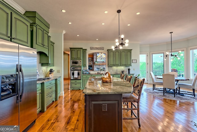 4431 Furman Gribble Rd, Young Harris, GA 30582 - kitchen with appliances with stainless steel finishes, green cabinetry, a chandelier, ornamental molding, and recessed lighting