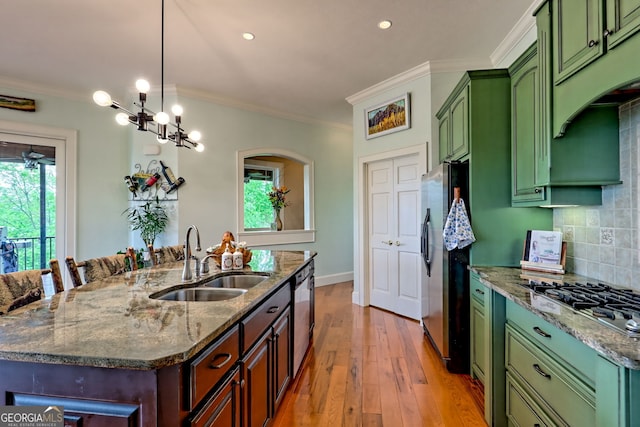 4431 Furman Gribble Rd, Young Harris, GA 30582 - kitchen featuring a sink, green cabinets, appliances with stainless steel finishes, light wood-style flooring, and crown molding