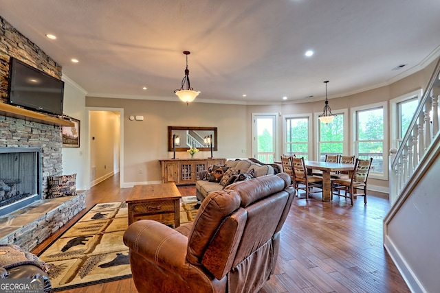 4431 Furman Gribble Rd, Young Harris, GA 30582 - living area featuring wood-type flooring, a fireplace, baseboards, recessed lighting, and crown molding
