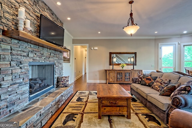 4431 Furman Gribble Rd, Young Harris, GA 30582 - living area featuring wood finished floors, recessed lighting, ornamental molding, a fireplace, and baseboards