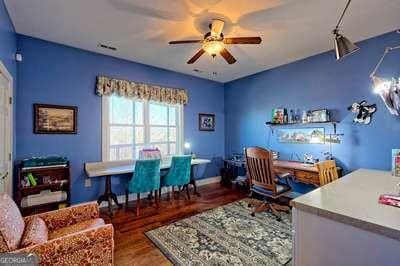 office space featuring hardwood / wood-style flooring and ceiling fan