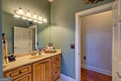 bathroom with vanity and hardwood / wood-style floors