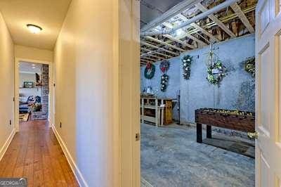 hallway featuring wood-type flooring