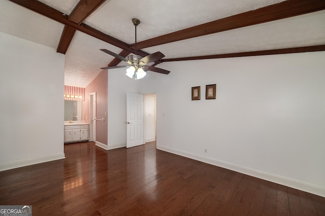 interior space featuring lofted ceiling with beams, baseboards, dark wood-style floors, and a ceiling fan