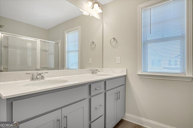 full bathroom featuring hardwood / wood-style flooring, bathing tub / shower combination, vanity, and toilet