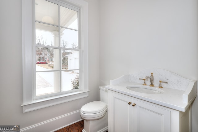 bathroom featuring vanity and toilet