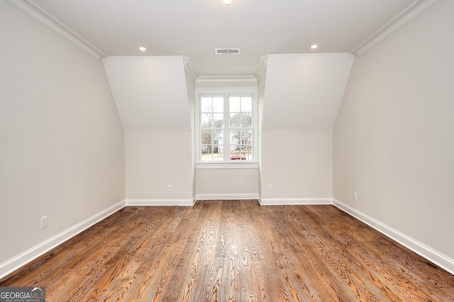 bonus room featuring hardwood / wood-style flooring and vaulted ceiling