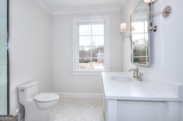 bathroom featuring vanity, crown molding, and toilet