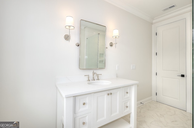 bathroom with crown molding and vanity