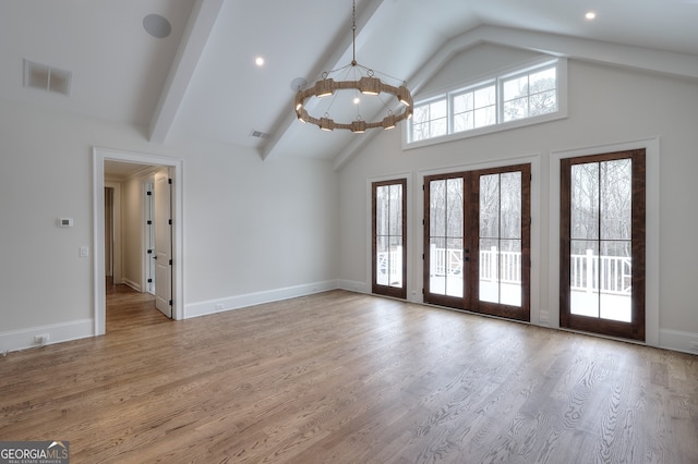 interior space with light hardwood / wood-style flooring, high vaulted ceiling, a notable chandelier, french doors, and beamed ceiling