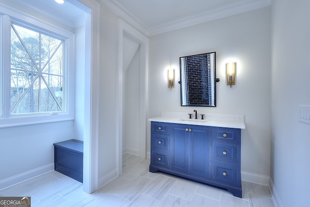 bathroom with crown molding and vanity