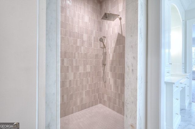 bathroom with tiled shower