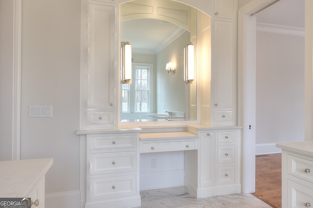 bathroom featuring vanity and crown molding