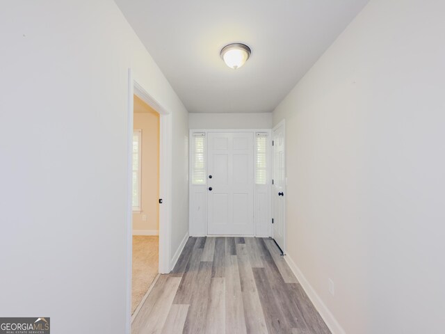 corridor featuring light hardwood / wood-style flooring