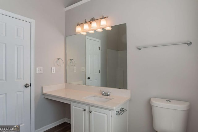 bathroom featuring vanity and toilet