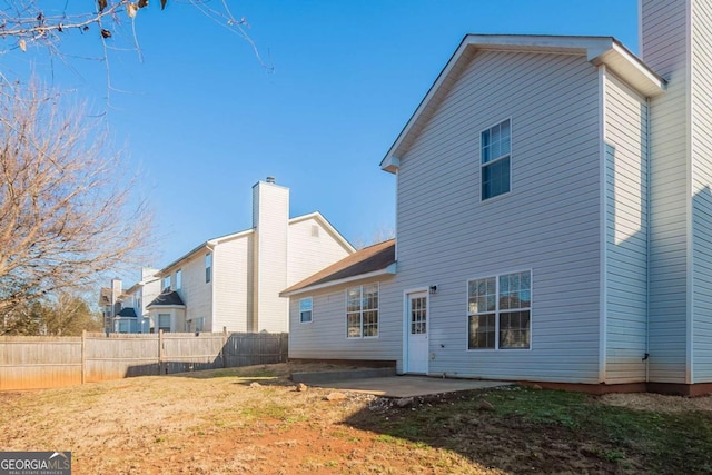 rear view of property featuring a patio