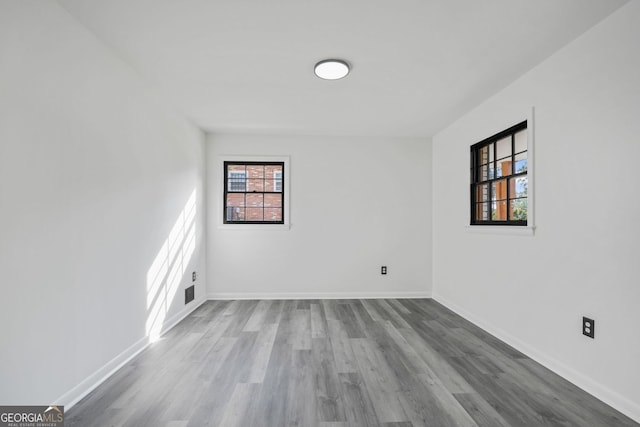 empty room featuring hardwood / wood-style flooring