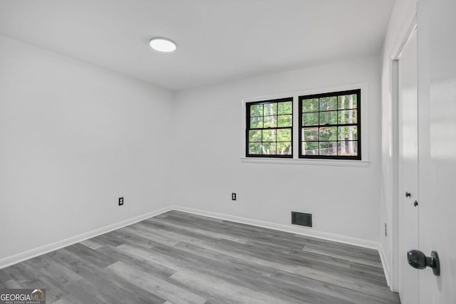 spare room with light hardwood / wood-style floors