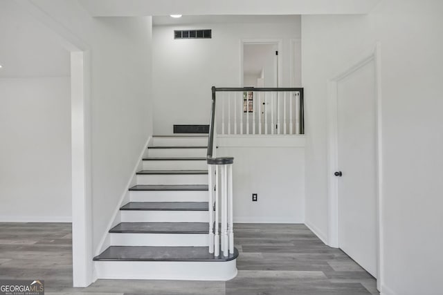 stairway with wood-type flooring