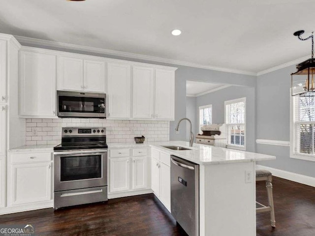 kitchen with sink, stainless steel appliances, and white cabinets