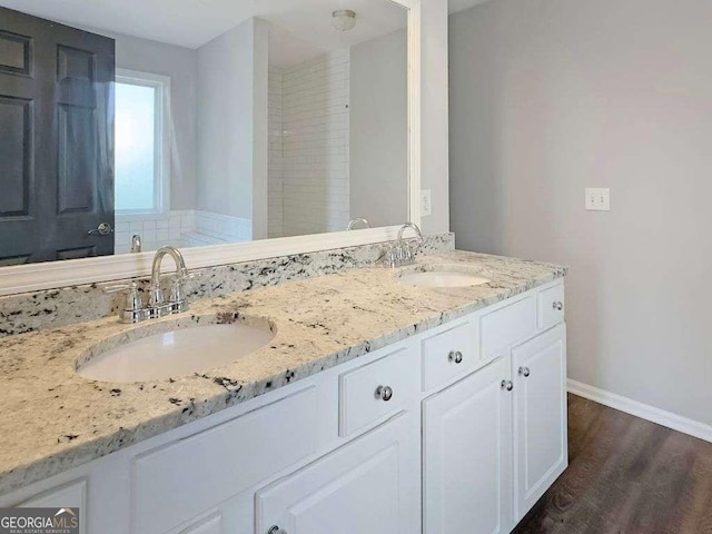 bathroom with vanity and wood-type flooring