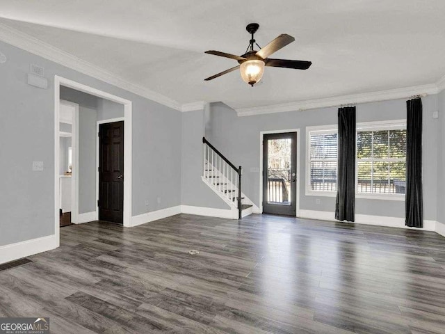 interior space with ornamental molding, dark wood-type flooring, and ceiling fan