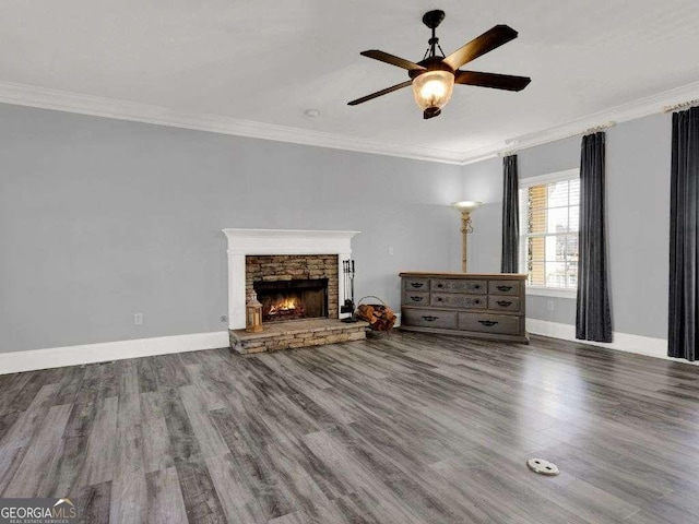 unfurnished living room with crown molding, ceiling fan, a fireplace, and hardwood / wood-style floors