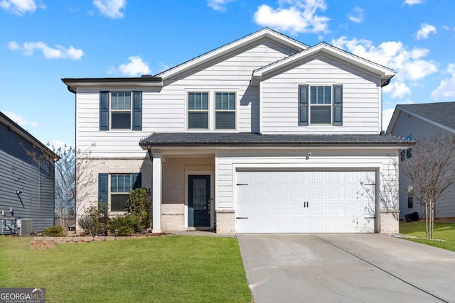 view of front property featuring a garage and a front yard