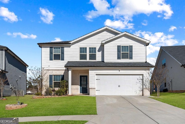 view of front property with a garage and a front yard