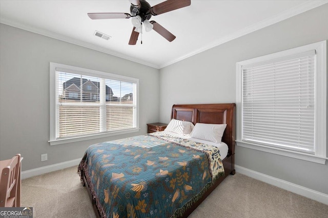 bedroom with light colored carpet, visible vents, ornamental molding, a ceiling fan, and baseboards