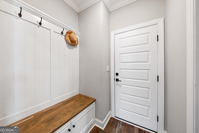 mudroom with ornamental molding, dark wood finished floors, and baseboards