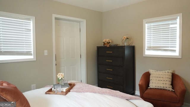 bedroom featuring multiple windows