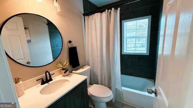 full bathroom with vanity, toilet, and shower / tub combo with curtain