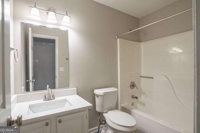 full bathroom with shower / bathtub combination, vanity, and toilet