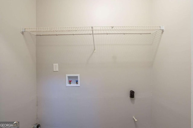 laundry room with washer hookup and electric dryer hookup