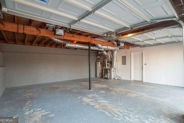 garage featuring water heater, a garage door opener, heating unit, and electric panel