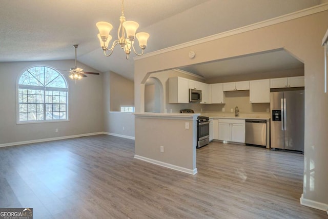 kitchen with stainless steel appliances, white cabinetry, sink, and light wood-type flooring